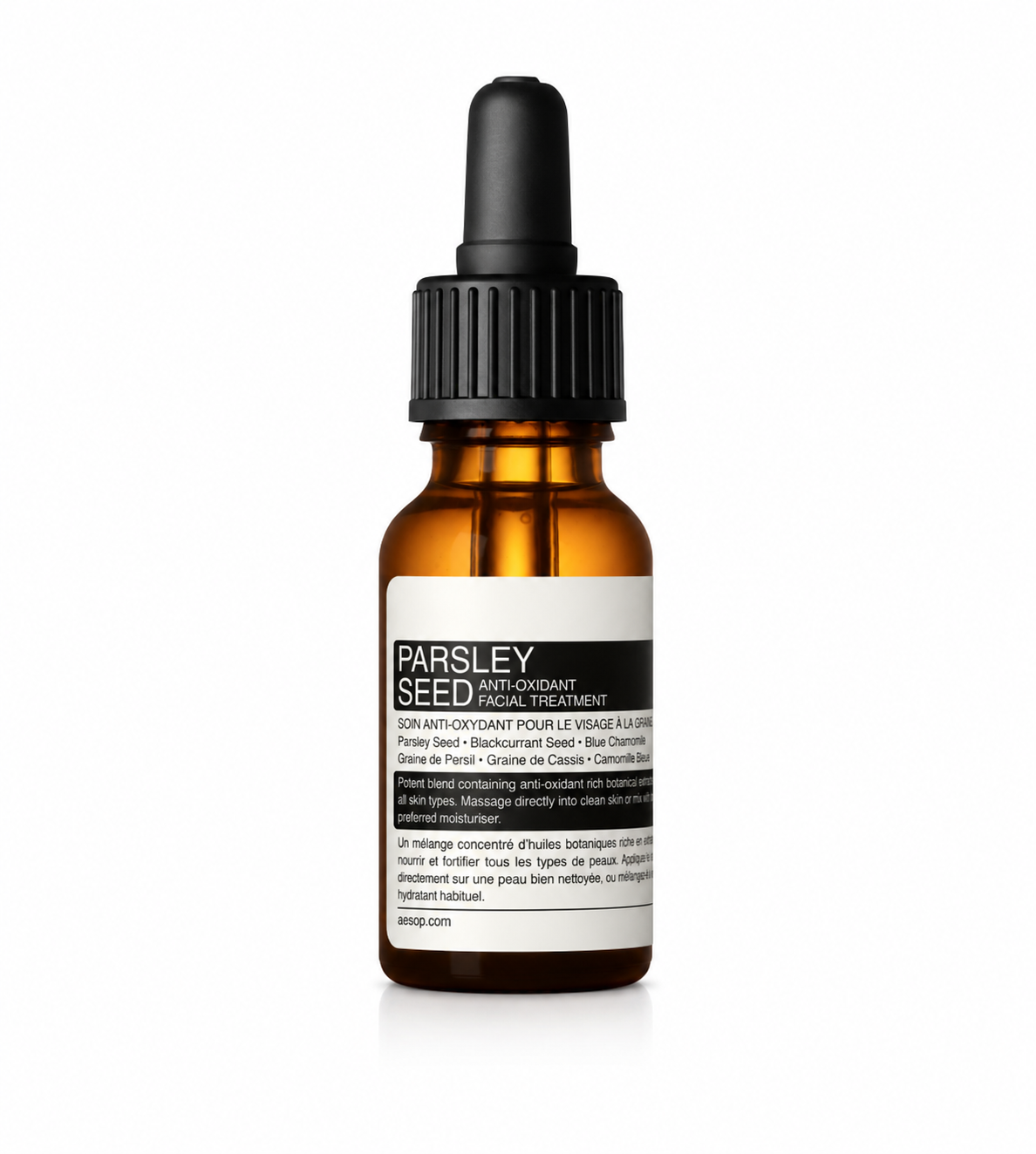 Aesop Parsley Seed Anti-Oxidant Facial Treatment in an amber glass bottle with a black dropper and Aesop's signature minimalist label, isolated on a white background. This lightweight facial treatment oil is enriched with parsley seed, blackcurrant seed, and blue chamomile to provide antioxidant protection, nourish the skin, support the skin barrier, and promote a healthy, radiant complexion for all skin types.