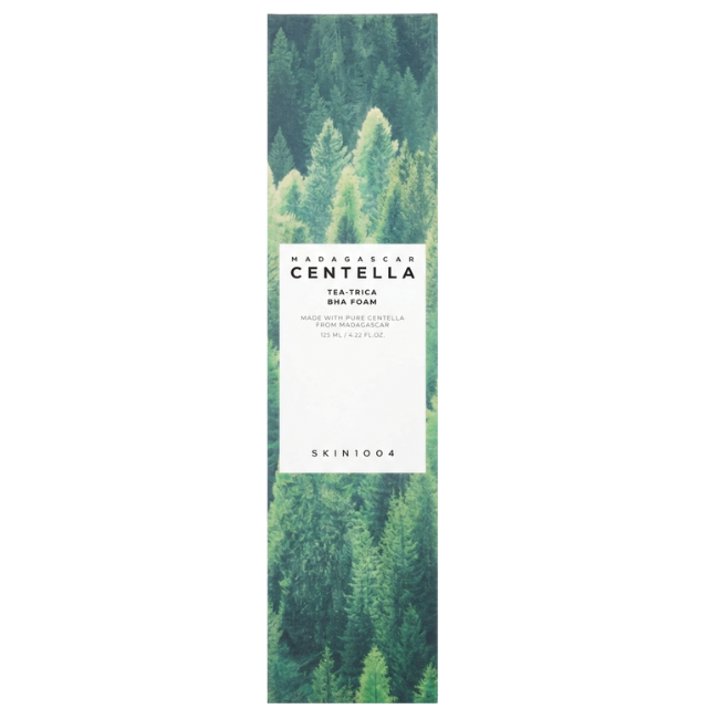 SKIN1004 Madagascar Centella Tea-Trica BHA Foam 125ml in a pale mint green squeeze tube next to its tall outer box featuring a detailed green forest graphic.