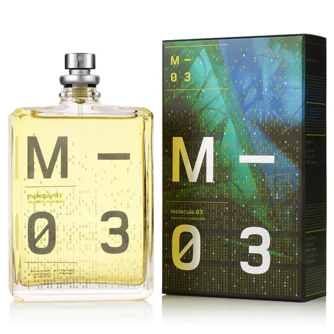 Escentric Molecules Molecule 03 fragrance set featuring a 100ml clear glass bottle with large "M 03" binary graphics, standing next to its coordinating dark teal and black textured box with high-contrast white and yellow branding.
